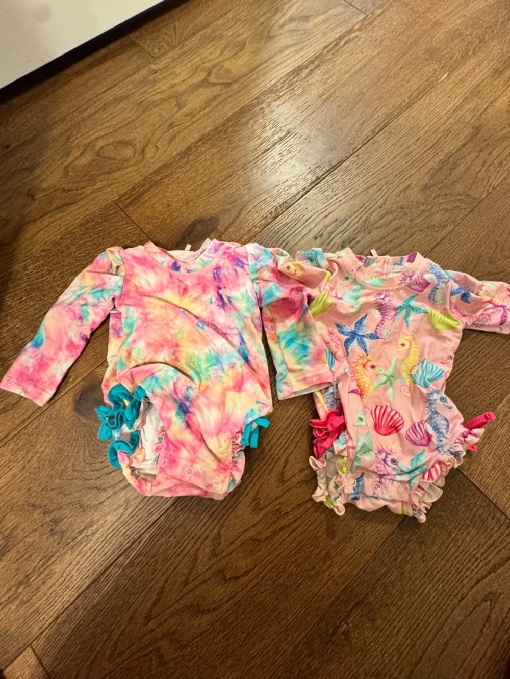 Posh Peanut Pink Tie-Dye Ruffle One-Piece; Seashore One-piece